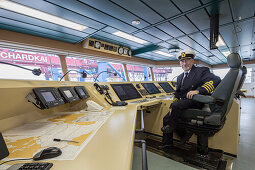 Captain Igor Sikic on the ship bridge, Burchardkai, Hamburg, Germany