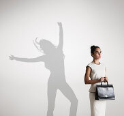 Woman with shadow in background dancing
