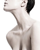 Woman with liquid droplets on neck