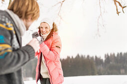 Couple having snowball fight