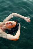 Woman relaxing in sea