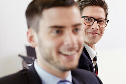 Headshot of businessmen smiling