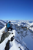 Female back-country skier ascending to Zwerchwand, Zillertal, Zillertal Alps, Tyrol, Austria