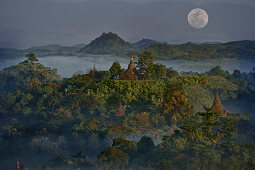 View above hill and pagodas in the morning mist at Mrauk U, Myohaung north of Sittwe, Akyab, Rakhaing State, Arakan, Myanmar, Burma