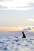 Female surfer waiting for a wave, Praia, Santiago, Cape Verde