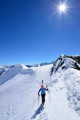 Two back-country skiers ascending to Piz Lagrev, Oberhalbstein Alps, Engadin, Canton of Graubuenden, Switzerland