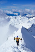 Female back-country skier ascending to Grosser Moeseler, Zillertal Alps, South Tyrol, Italy