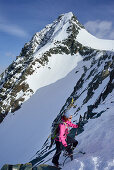 Female back-country skier ascending to Grossglockner, Glockner Group, High Tauern National Park, East Tyrol, Tyrol, Austria