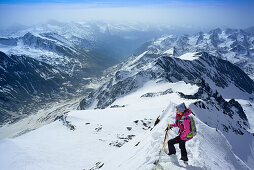 Woman ascending to Grossglockner, Glockner Group, High Tauern National Park, East Tyrol, Tyrol, Austria
