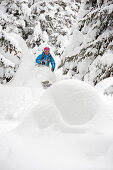 Woman downhill skiing, St Anton am Arlberg, Tyrol, Austria