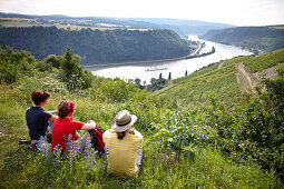 Hikers enjoying view over Rhine Gorge, Sankt Goarshausen, Rhineland-Palatinate, Germany
