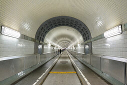 People walking through Alter Elbtunnel, Alter Elbtunnel, Hamburg, Germany