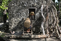 Ivatan woman, old stone house in Chavayan, Sabtang Island, Batanes, Philippines, Asia
