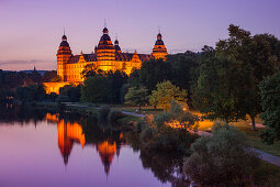 Johannisburg Palace and parklands along the Main river at dusk, Aschaffenburg, Franconia, Bavaria, Germany