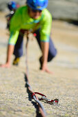 Woman climbing on granite slab, Sector Crow, Grimsel pass, Bernese Oberland, Switzerland