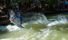 Surfer on the Eisbach river in the English Gardens, Munich, Upper Bavaria, Bavaria, Germany