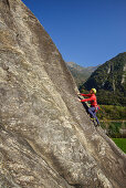 Man climbing on Gneiss rock, Torbeccio, valley of Maggia, Ticino, Switzerland
