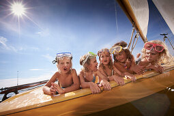 Girls in a sailing boat on lake Starnberg, Upper Bavaria, Bavaria, Germany