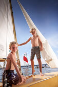 Two boys on a sailing boat, lake Starnberg, Upper Bavaria, Bavaria, Germany