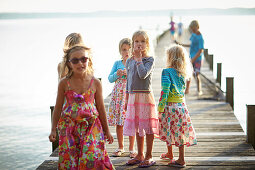 Children on a jetty, lake Starnberg, Upper Bavaria, Bavaria, Germany