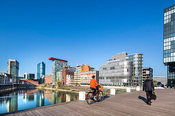 Cyclists, Media harbour, Duesseldorf, North Rhine Westphalia, Germany