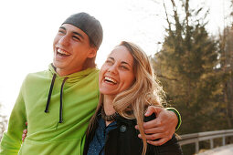 Laughing young couple, Grosser Alpsee, Immenstadt, Bavaria, Germany