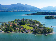 Aerial shot of Fraueninsel, Kampenwand in background, lake Chiemsee, Bavaria, Germany