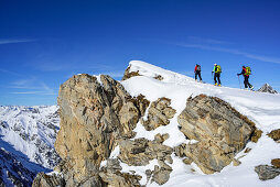 Three persons back-country skiing ascending towards Frauenwand, Frauenwand, valley of Schmirn, Zillertal Alps, Tyrol, Austria