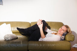 Young woman sitting on the sofa, Relaxing