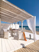 Terrace by the sea with table and chairs, Mallorca, Balearic Islands, Spain