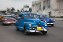 Zoomed vintage American car taxis in front of Capitol building, Havana, Havana, Cuba