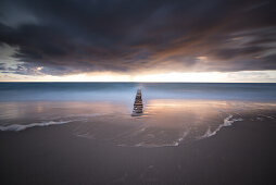 Sunset with storm clouds on the Baltic Sea in the Western Pomerania Lagoon Area National Park, Dierhagen, Fischland-Darss-Zingst, Mecklenburg-Western Pomerania, Germany