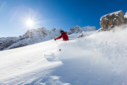 skier in deep powder snow, Zugspitze, Upper Bavaria, Germany