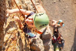 Girl rock climbing, Port de Soller, Serra de Tramuntana, Majorca, Balearic Islands, Spain, Europe