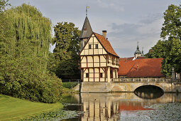 Gate house and bridge over the Graefte of Steinfurt castle , Steinfurt - Burgsteinfurt , Muensterland , North Rhine-Westphalia , Germany , Europe