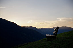 Bench for hikers in the mountains at sunset, Rote Flueh, Gimpel, Hochwiesler, Tannheimer Tal, Tyrol, Austria