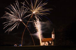 Fireworks over Hub-chapel at New Year's Eve, Penzberg, Upper Bavaria, Germany, Europe