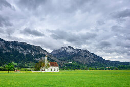 Church St. Coloman at Romantic Road with Saeuling and Castle Neuschwanstein in background, Ammergau Alps, Allgaeu, Swabia, Bavaria, Germany