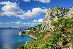 Coast at Golfo di Orosei with rock spire Pedra Longa, Selvaggio Blu, National Park of the Bay of Orosei and Gennargentu, Sardinia, Italy