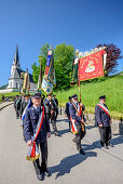 Procession during religious festival of Feast of Corpus Christi, church of Kreuth in background, Kreuth, Bavarian Alps, Upper Bavaria, Bavaria, Germany