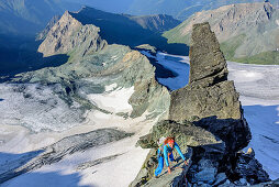 Woman climbing ridge Stuedlgrat towards Grossglockner, Stuedlgrat, Grossglockner, High Tauern, East Tyrol, Austria