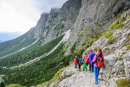 Several persons descending through valley Val Canali, Rifugio Pradidali, Pala range, Dolomites, UNESCO World Heritage Dolomites, Trentino, Italy