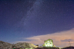 Stary sky with milky way above hut Rifugio Rosetta, Pala range, Dolomites, UNESCO World Heritage Dolomites, Trentino, Italy