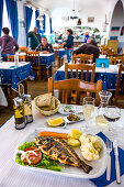 Grilled fish in a restaurant, Algarve, Portugal