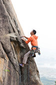 Sport climbing near Xiamen, rock climbing, young man, climbing area Nantaiwu, granite rock, Xiamen, Fujian, China, Asia