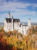 View of the castle Neuschwanstein from Marienbruecke in Autumn, Upper Allgaeu, Bavaria, Germany