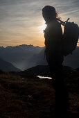 A hiker near Gufelstock, Glarus Alps, canton of Glarus, Switzerland
