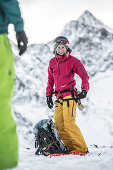 Young female snowboarder in the mountains, Pitztal, Tyrol, Austria