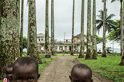 Native little children in front of a simple house, Sao Tome, Sao Tome and Principe, Africa