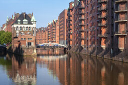 Moated castle Wasserschloss in quarter Speicherstadt at Wandrahmsfleet, Hanseatic City Hamburg, Northern Germany, Germany, Europe